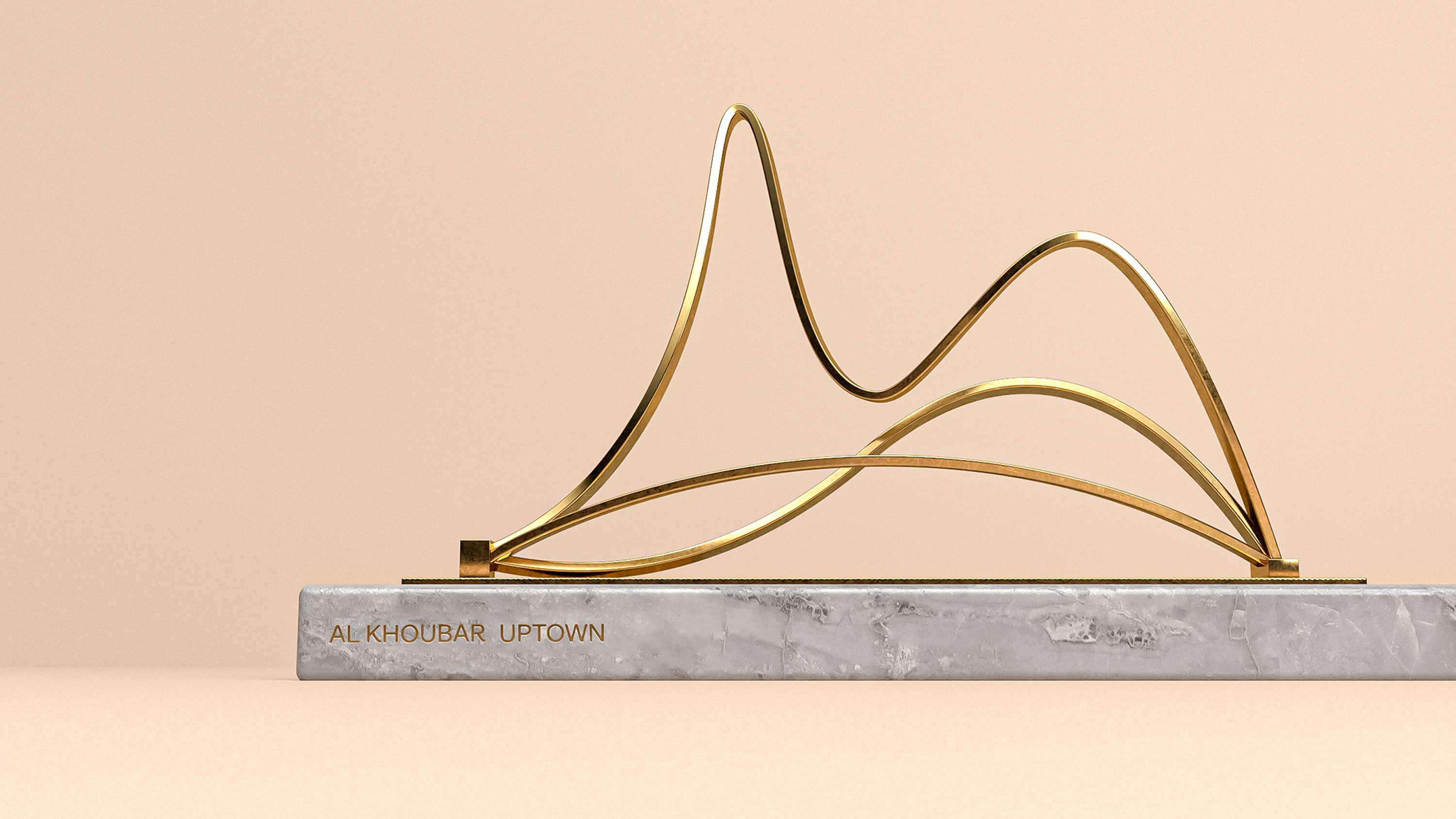 Gold wire sculpture on a marble base against a peach background